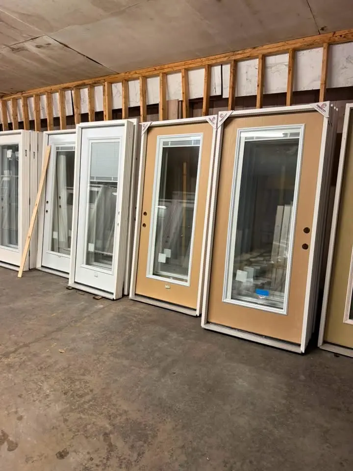 Entry doors with full-height glass panels in several finishes