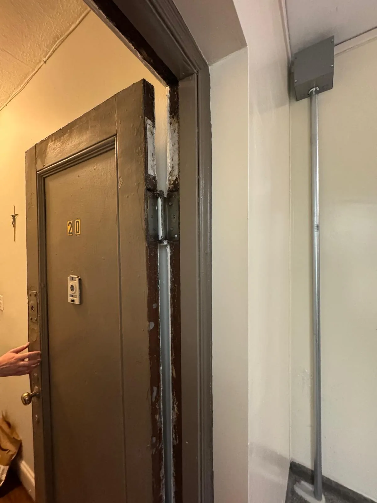 Gray metal entry door closer