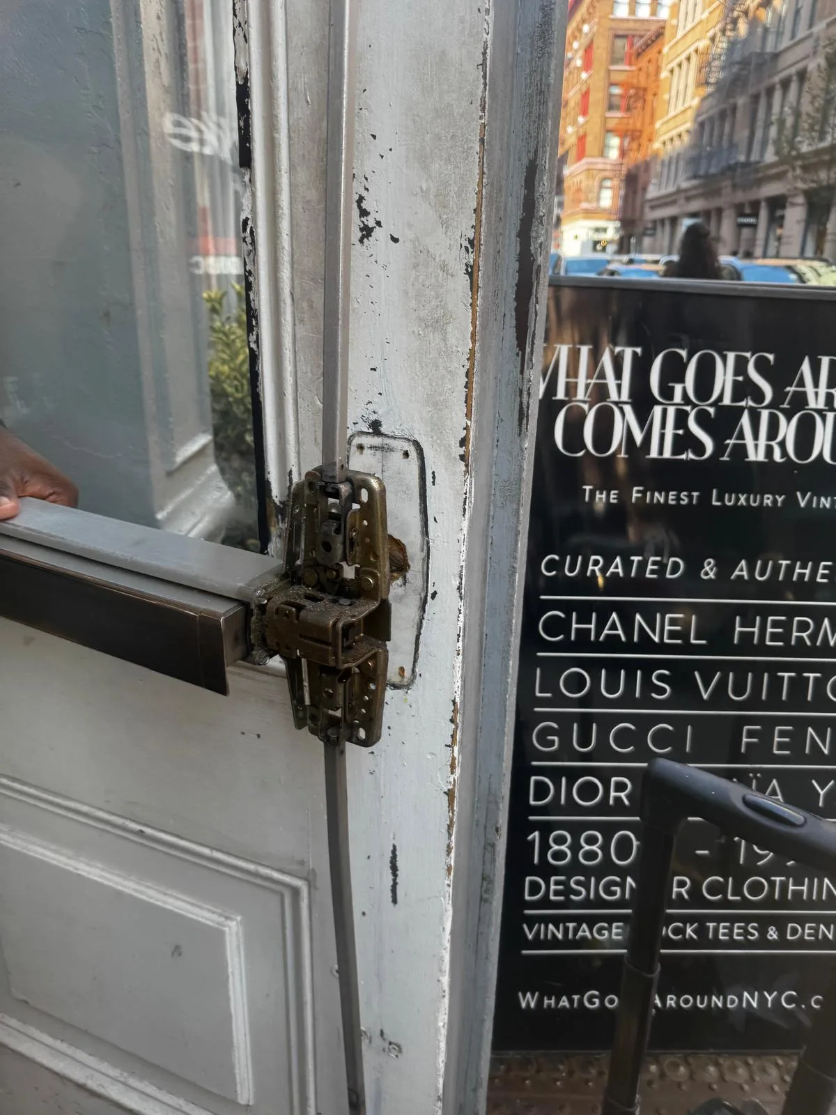 Glass entry door panic bar closeup