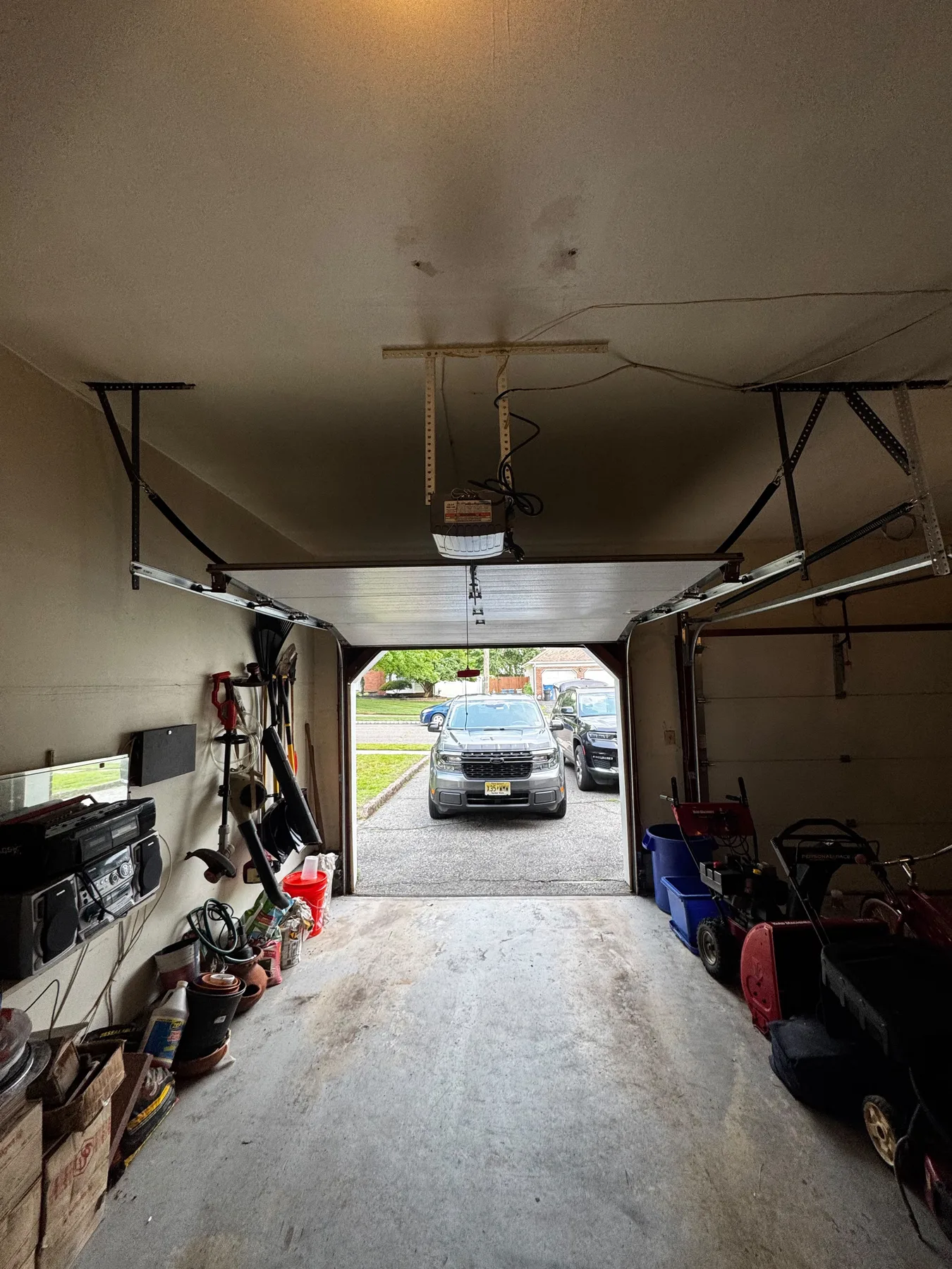 Garage door interior track and cable