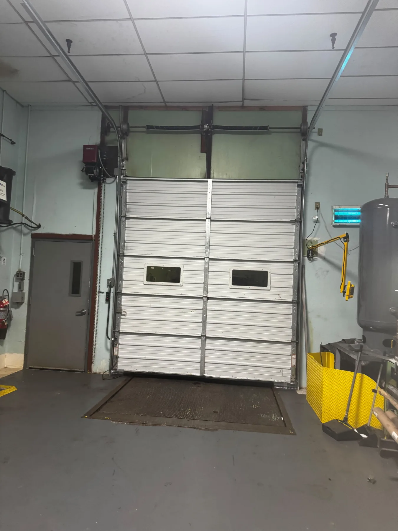White commercial garage door after repair