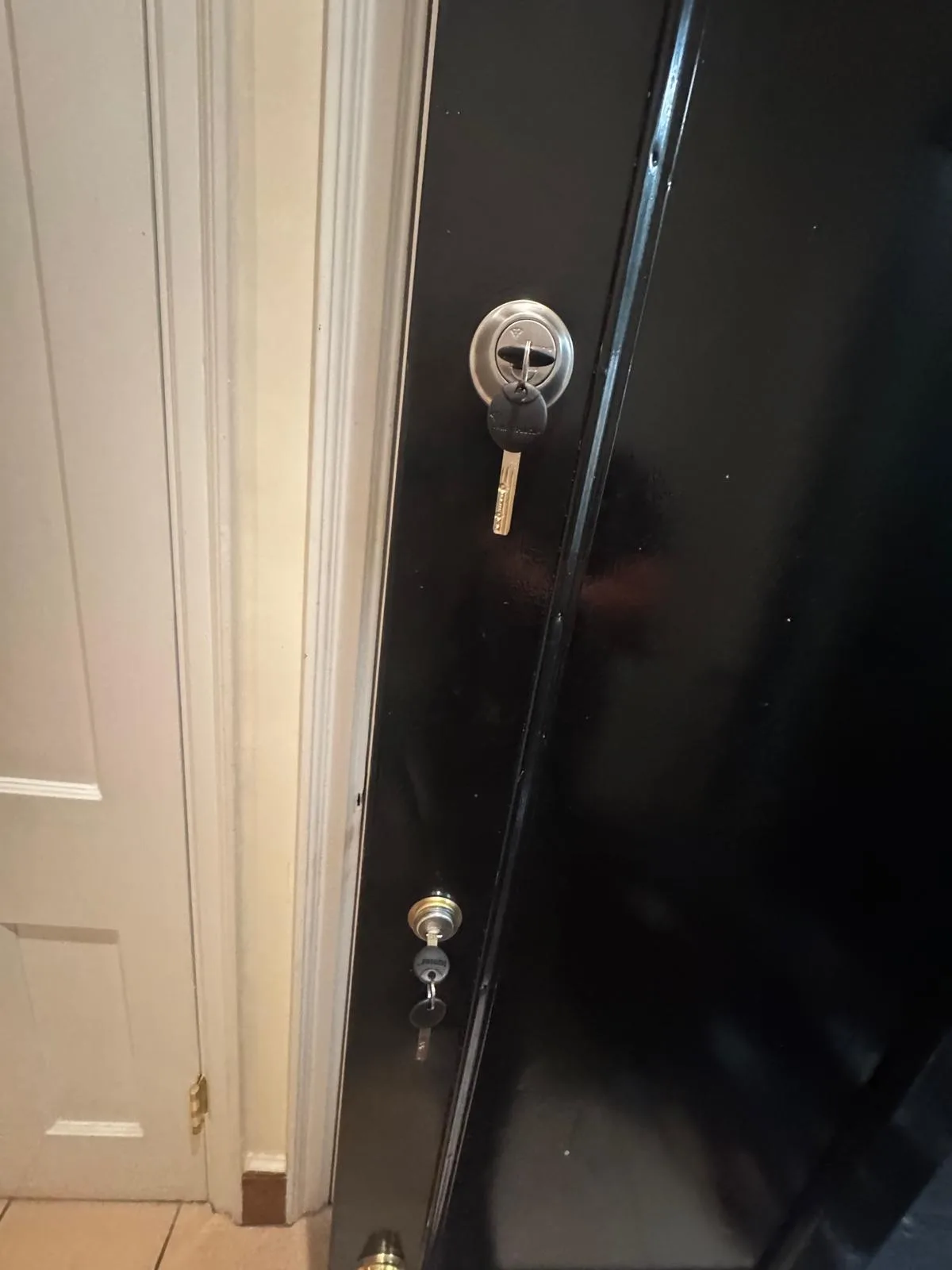 Dark door deadbolt lock closeup